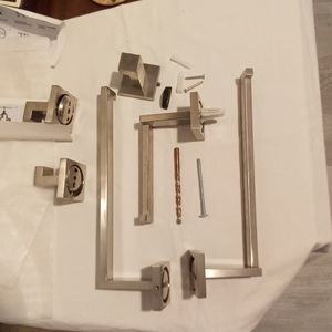 Bathroom Fixtures - 2 Towel Holders, 3 Hooks, and 1 Toilet Paper Holder.